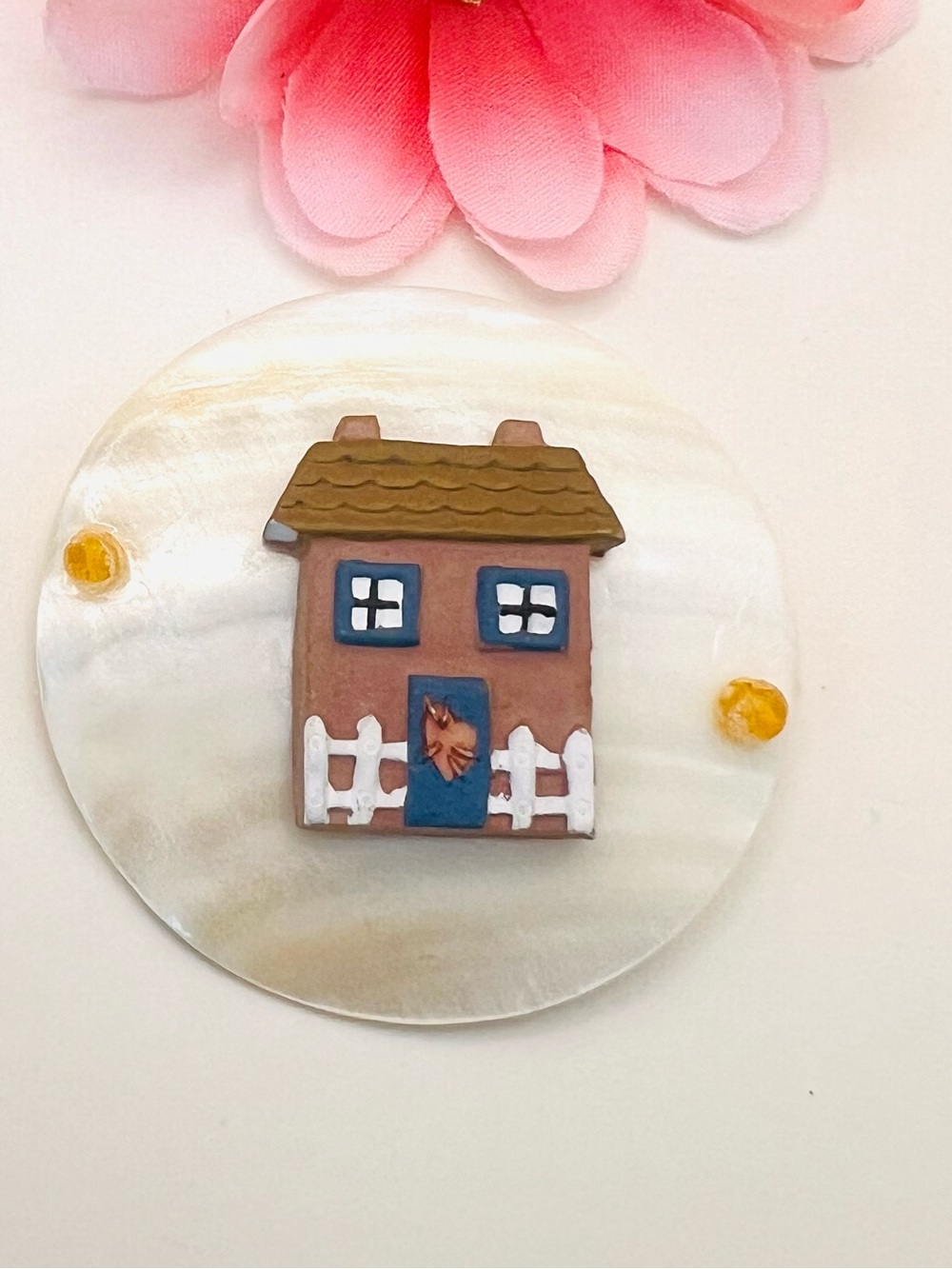 Round mother of pearl Brown & Blue House brooch